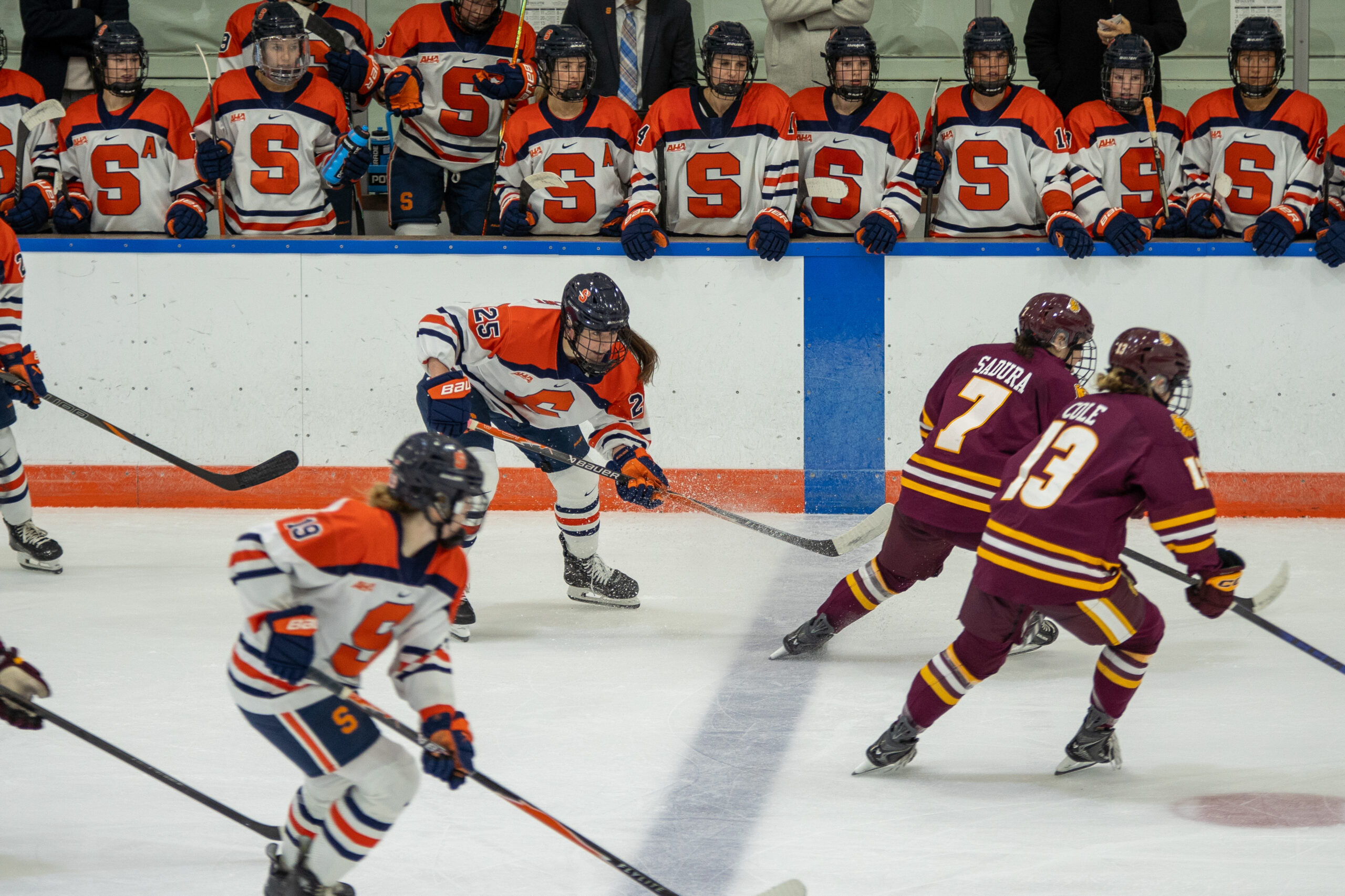 Syracuse's bench looks over forward Makenna Williment in a tough home opener Thursday at the Tennity Ice Pavilion.