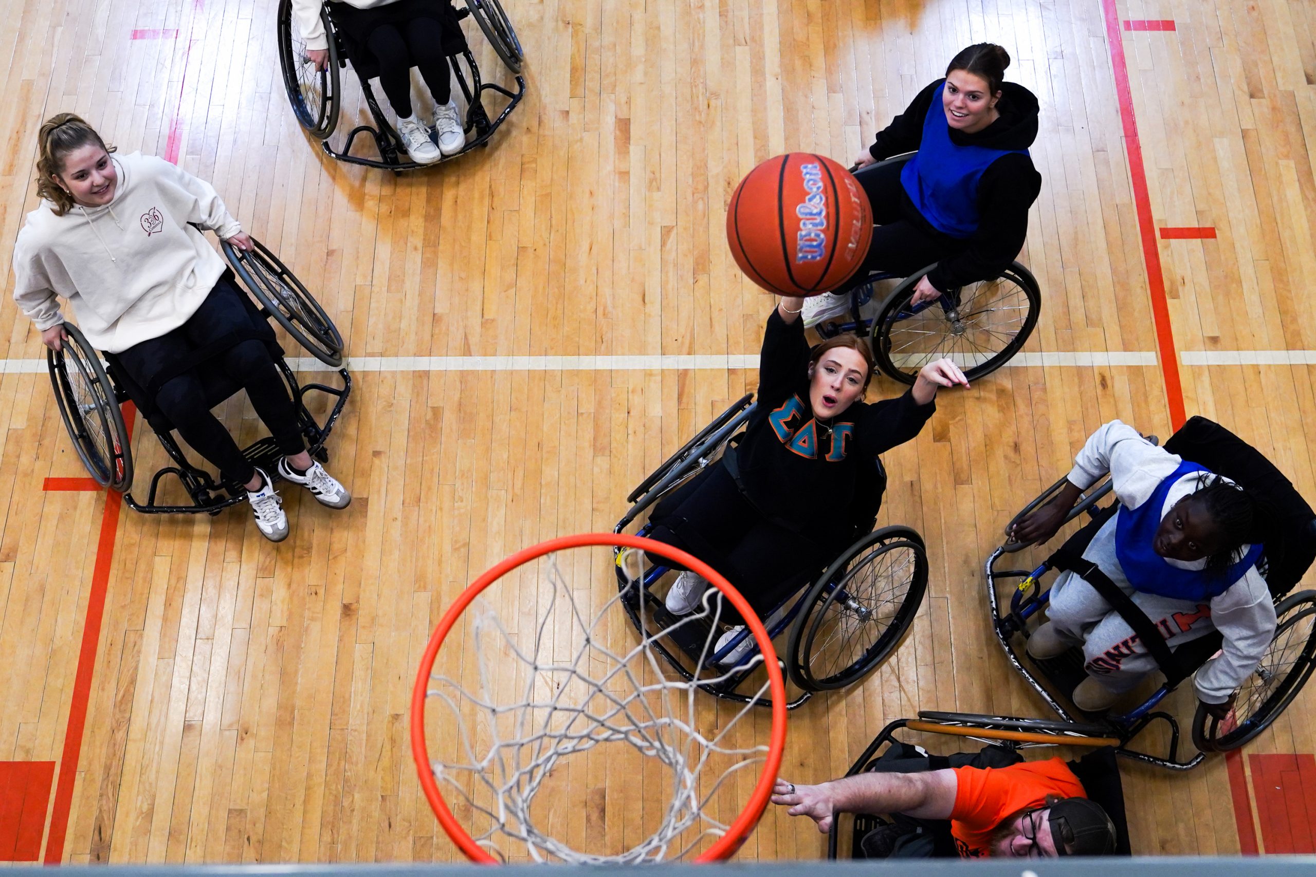 A member of Sigma Delta Tau shoots a basket during the wheelchair basketball game at the Barnes Center on April 5, 2025 OrangeAbility, SU's Disability Awareness Month (Photo by Jack Henry / Newhouse School)