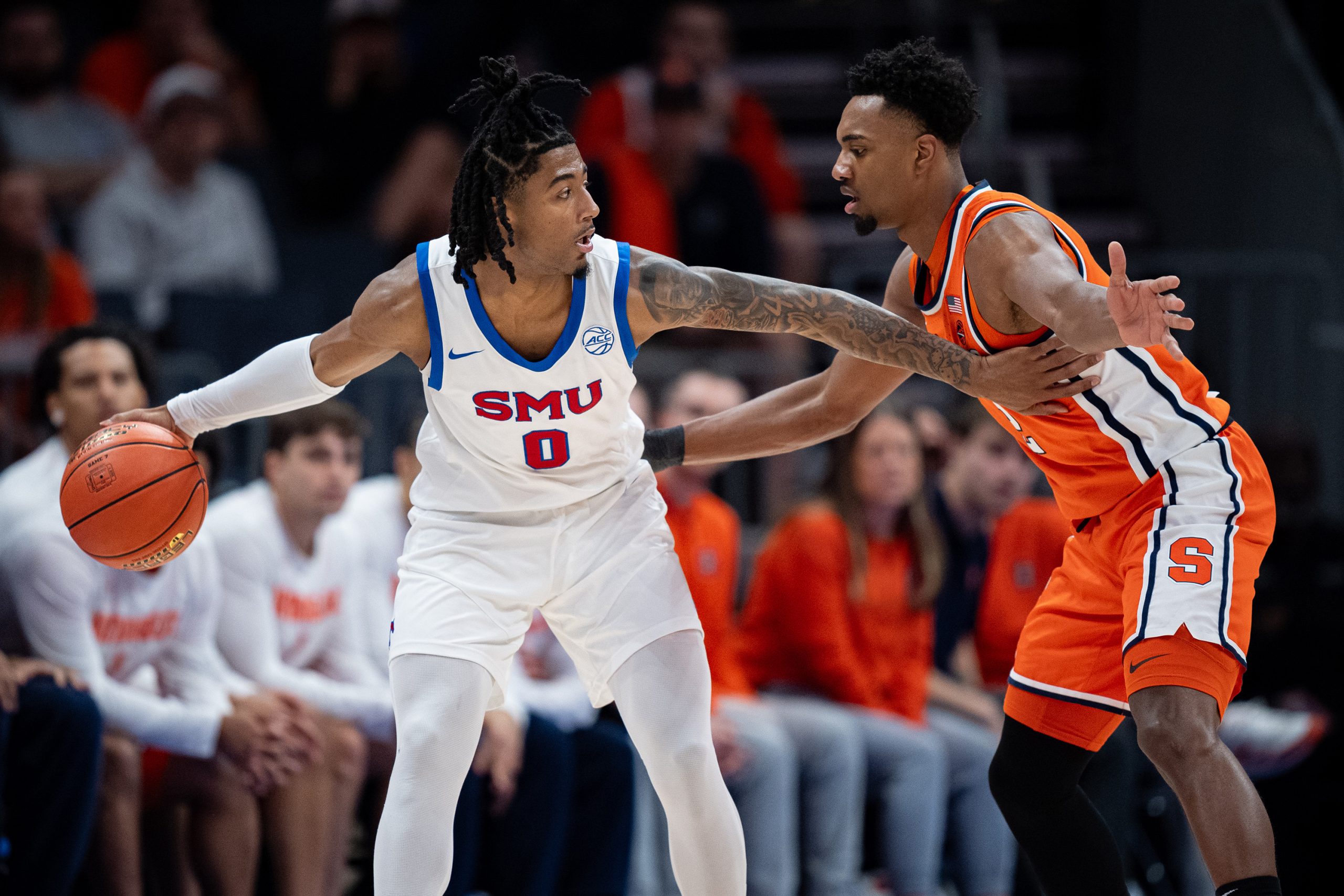 J.J. Starling #2 of the Syracuse Orange guards B.J. Edwards #0 of the SMU Mustangs in the first half during the second round of the ACC men's basketball tournament at Spectrum Center on March 12, 2025 in Charlotte, North Carolina.