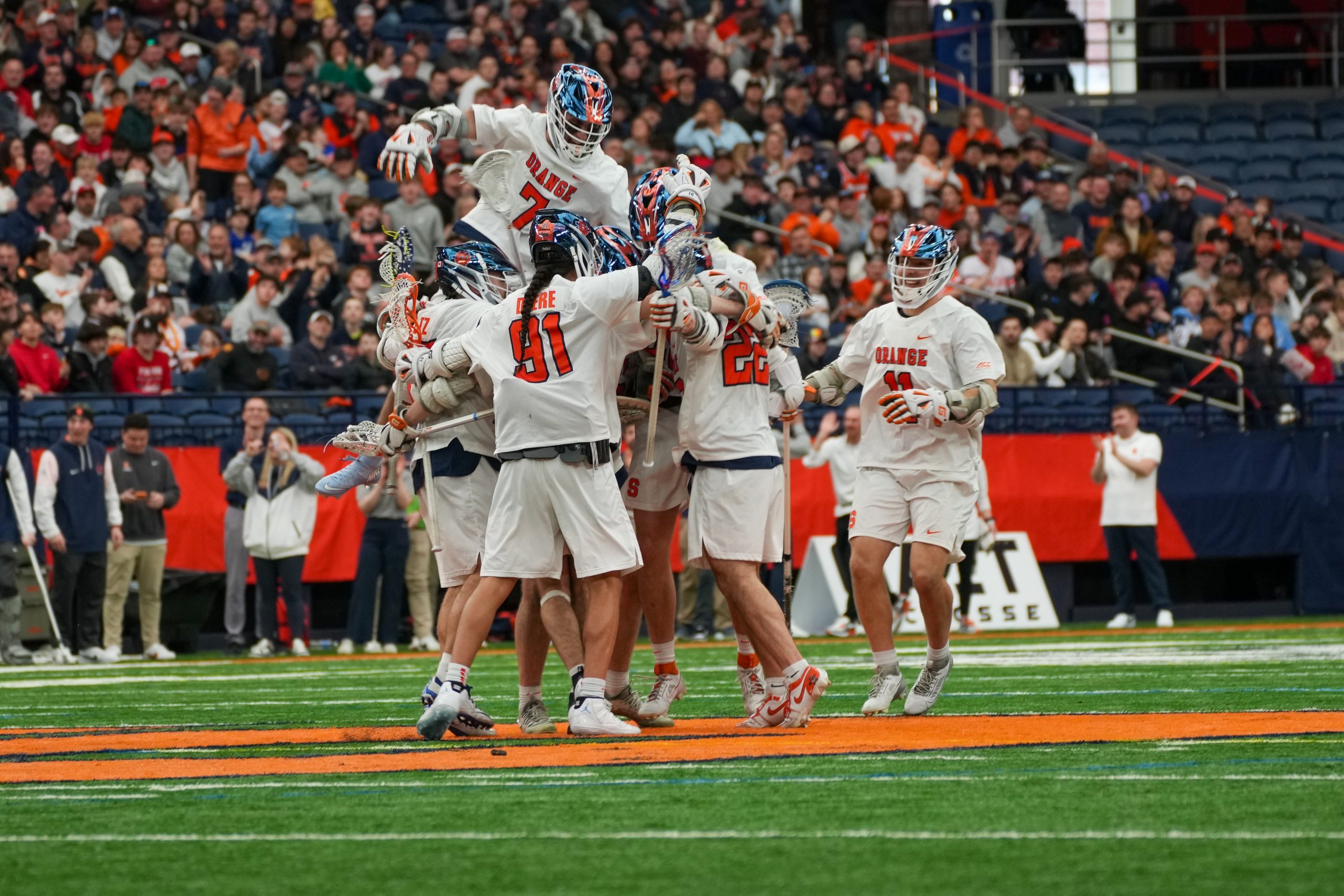 The Orange celebrate after a goal against John Hopkins. After dropping two games at the end of February, Syracuse has won back-to-back games.