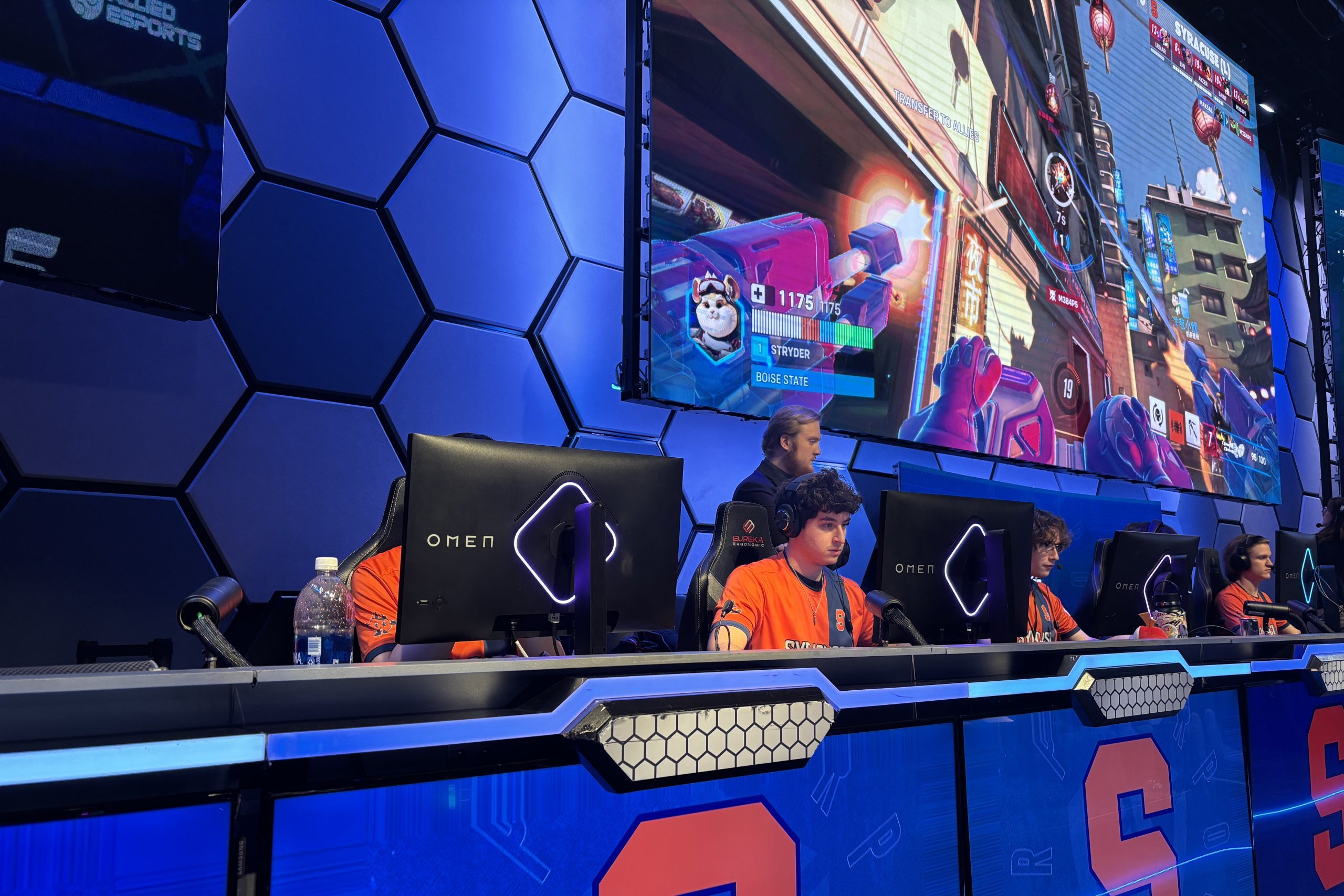 Syracuse's Overwatch team competes against Boise State on stage at HyperX Arena.