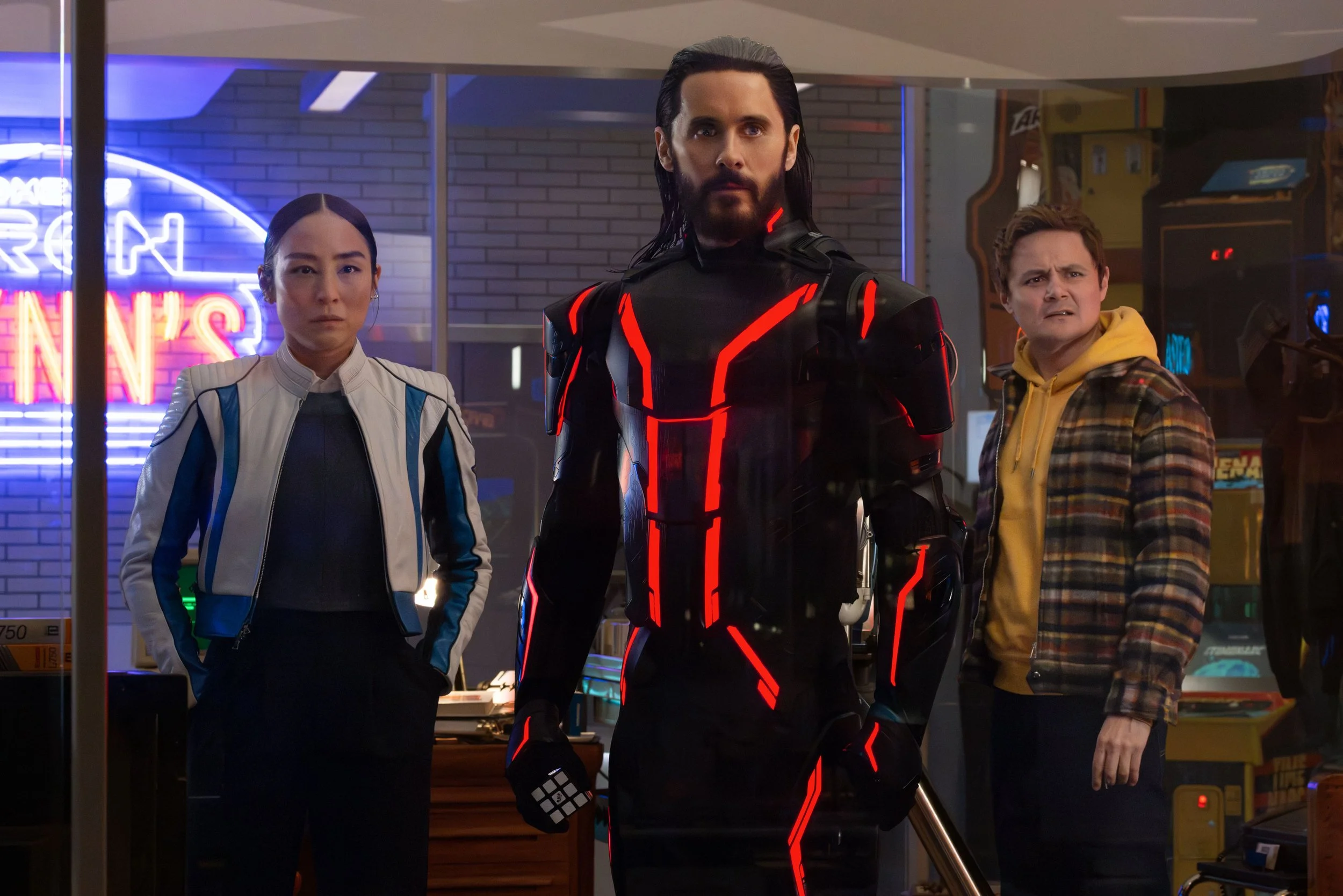 From left, Greta Lee, Jared Leto and Arturo Castro in “Tron: Ares.”