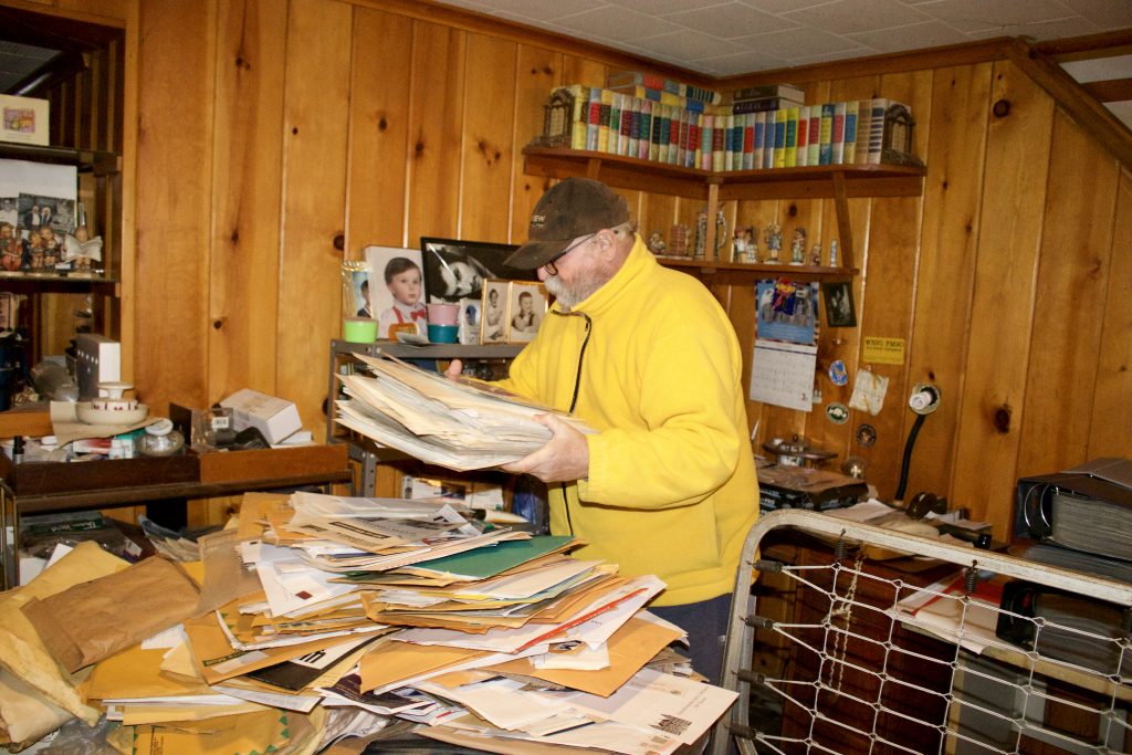 Richard Block sifts through his autograph collection.