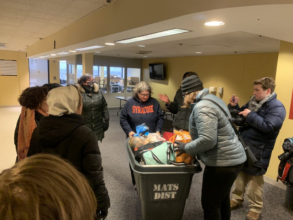 Faculty and staff members deliver donations to 111 Waverly St. for #NotAgainSU students.