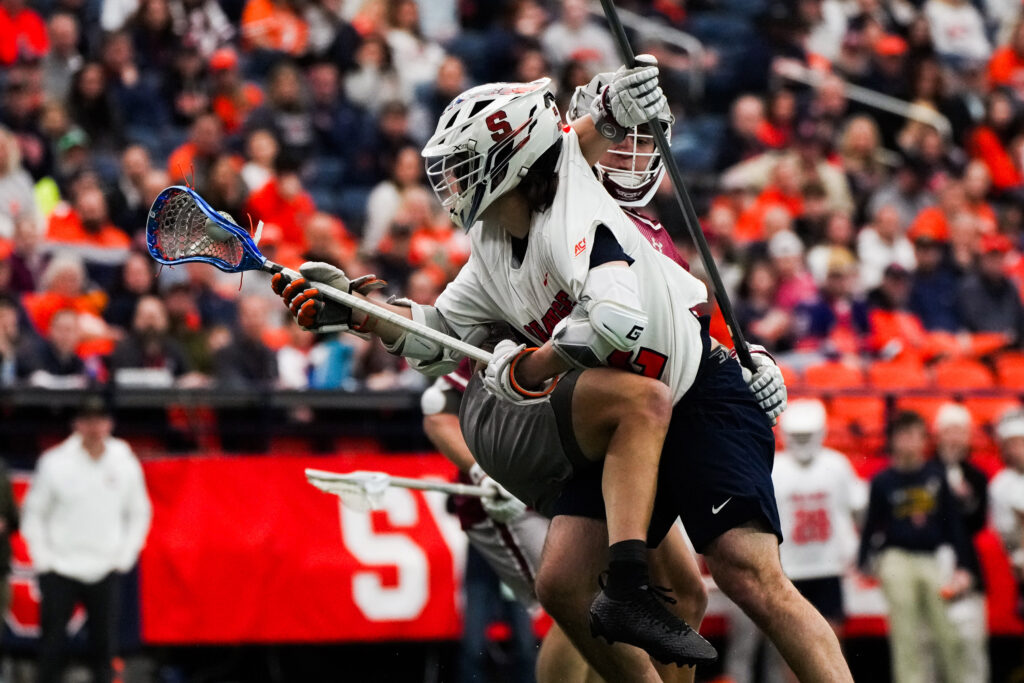 Attacker Joey Spallina fights through the Colgate defense at the JMA Wireless Dome on Saturday. (Photo by Jack Henry / Newhouse School)