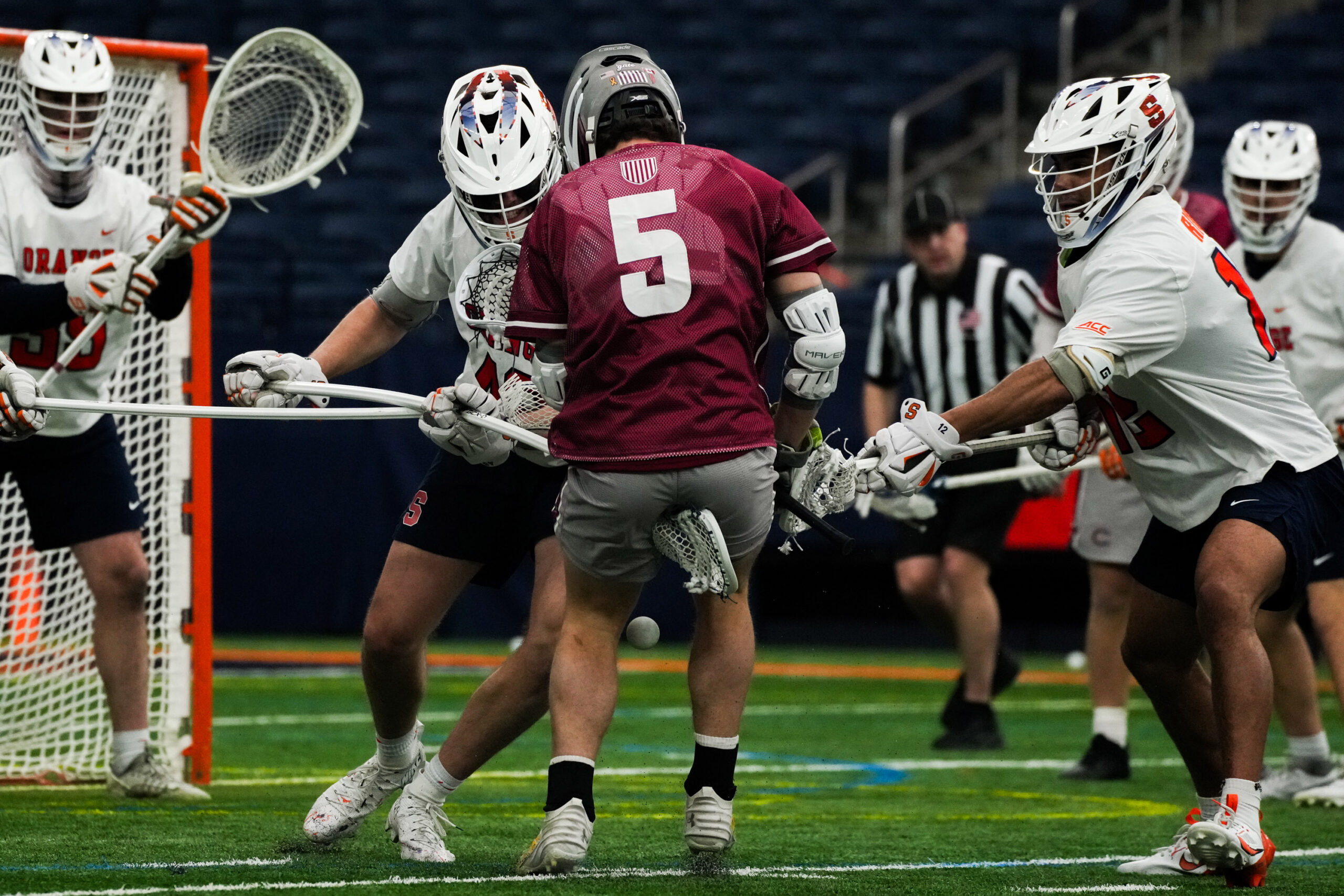 Syracuse players block a Colgate shot attempt on Saturday at the JMA Wireless Dome. (Photo by Jack Henry / Newhouse School)