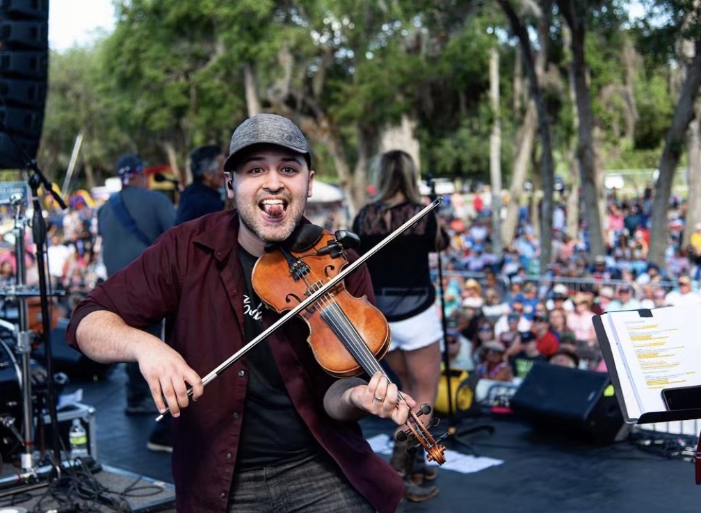 Johnny Warren playing the fiddle.
