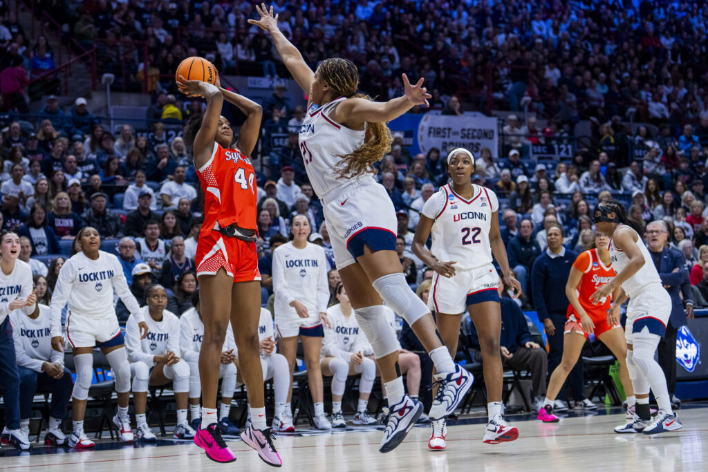 Uche Izoje #44 of the Syracuse Orange shoots against Sarah Strong #21 of the Connecticut Huskies during the first half in the second round of the 2026 NCAA Women's Basketball Tournament at Harry A. Gampel Pavilion on March 23, 2026 in Storrs, Connecticut. (