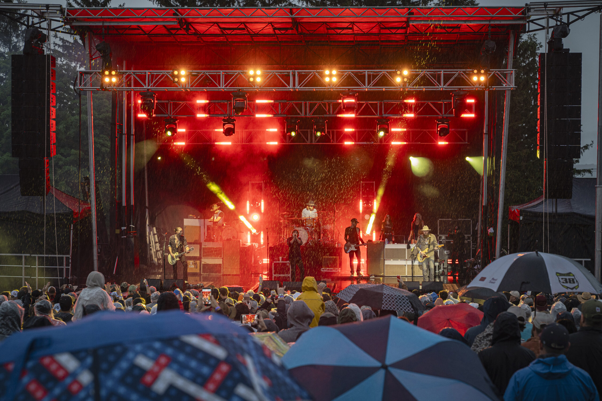 Whiskey Myers started off the show with a harmonica in hand under red stage lights during a rain-soaked set at Beak & Skiff Apple Orchards on Sunday, June 14, 2026, in Lafayette, N.Y. Photo by Matt Hofmann