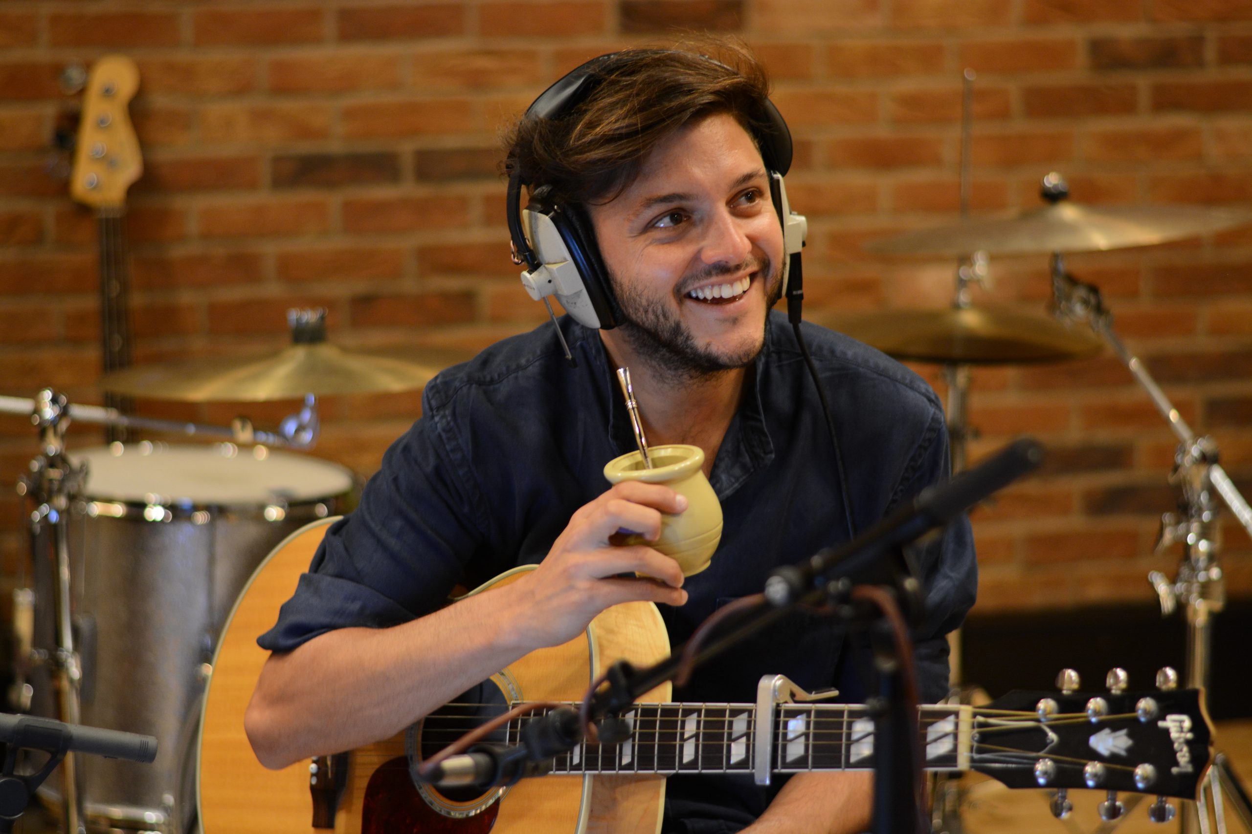 Andi Pomato drinking mate while recording.