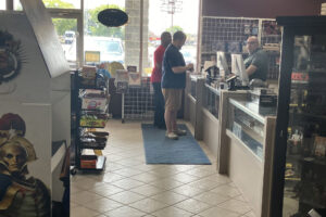 Customers buy comics and figurines in North Syracuse’s Comix Zone, at 682 Main St.