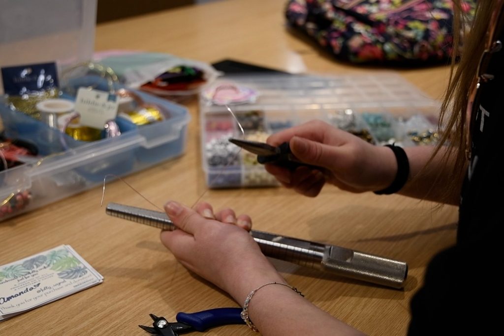 Amanda Kruman makes and sells handmade jewelry on her Instagram page @fullywyred.