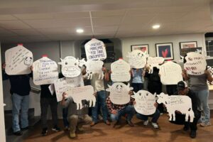 Group members of Alianza Agrícola drew cows and milk jugs with messages that translate to: “We work so your family can have food every day,” “We produce, but everyone consumes,” “Immigrants deserve to be paid well for all the work they do,” and “No more raids. NY4All now!”