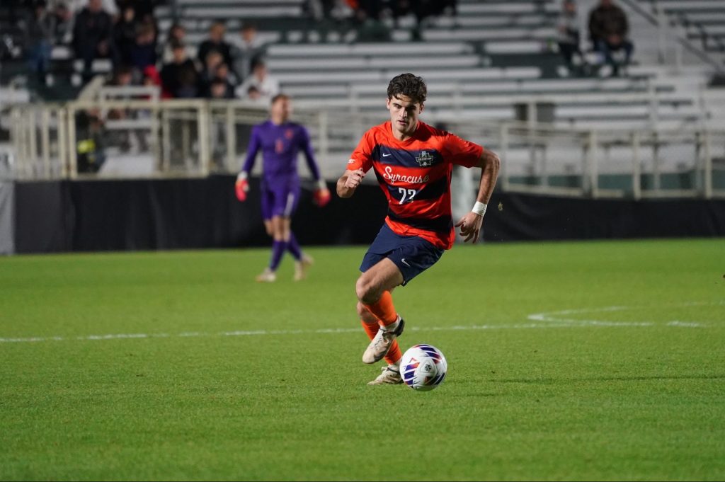Orange midfielder Jackson Glenn dribbled the ball during the NCAA semifinal match against Creighton on Dec. 9, 2022.