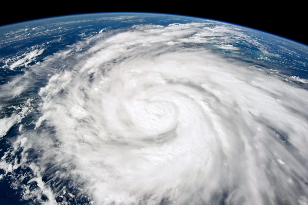 A satellite image of a hurricane forming over the ocean.
