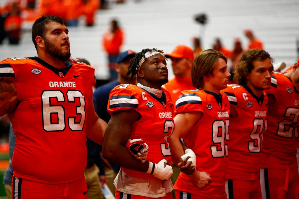 SYRACUSE, NY - OCTOBER 29: The Syracuse Orange link arms during the alma mater after losing to Notre Dame Fighting Irish at JMA Wireless Dome on October 29, 2022 in Syracuse, New York. (Photo by Isaiah Vazquez/The Newshouse)