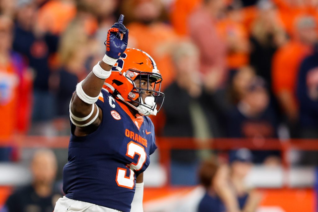 Mikel Jones #3 of the Syracuse Orange celebrates breaking a play against the Virginia Cavaliers