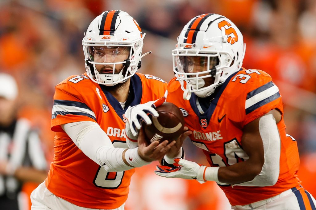 SYRACUSE, NY - OCTOBER 1: Garrett Shrader #6 of Syracuse Orange hands the ball to Sean Tucker #34 of Syracuse Orange at JMA Wireless Dome on October 1, 2022 in Syracuse, New York. (Photo by Isaiah Vazquez)