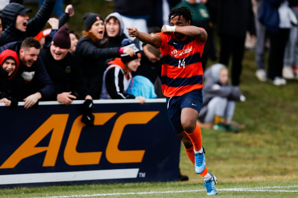 SYRACUSE, NY - DECEMBER 3: Levonte Johnson #14 of the Syracuse Orange reacts after scoring the second goal against the Vermont Catamounts during the quarterfinals of the NCAA Men’s Soccer Championship at SU Soccer Stadium on December 3, 2022 in Syracuse, New York. (Photo by Isaiah Vazquez/The Newhouse)