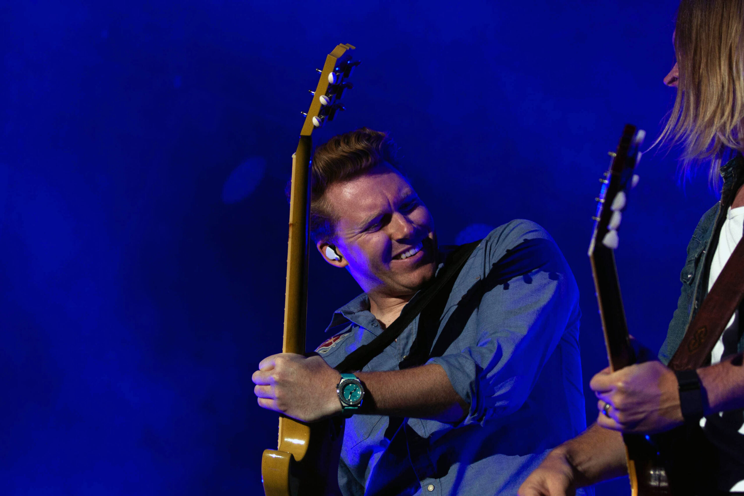 A guitarists rock on stage to Dustin Lynch's performance on the Suburban Park stage at the New York State Fair.