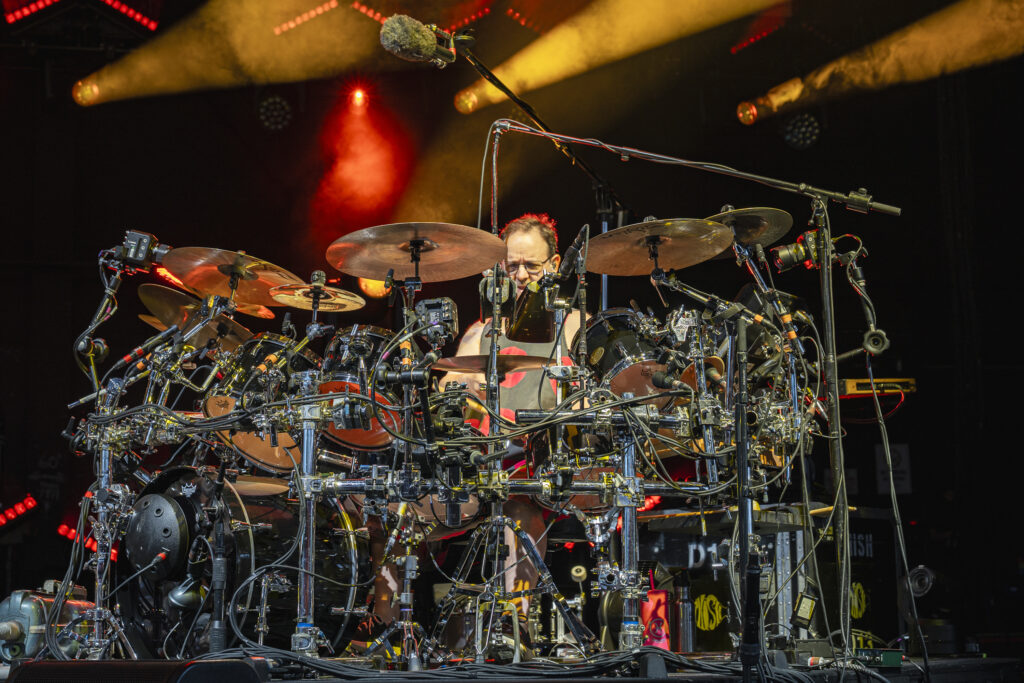 Jon Fishman performs behind his expansive drum kit during Phish’s concert at Empower Federal Credit Union Amphitheater at Lakeview in Syracuse, N.Y., on Tuesday, July 21, 2026. The performance was a homecoming for Fishman, who grew up in the Syracuse area and graduated from Jamesville-DeWitt High School in 1983. Photo by Matt Hofmann