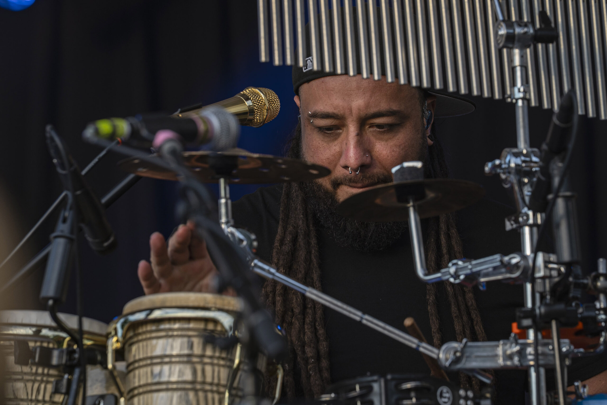 Jason Tupuola-Aiono of Seven Suns performs at Paper Mill Island in Baldwinsville on Friday, Aug. 14, 2026. The Honolulu-based group draws from reggae, R&B, soul and pop, bringing together musicians with deep roots in Hawai‘i’s music scene. Photo by Matt Hofmann.