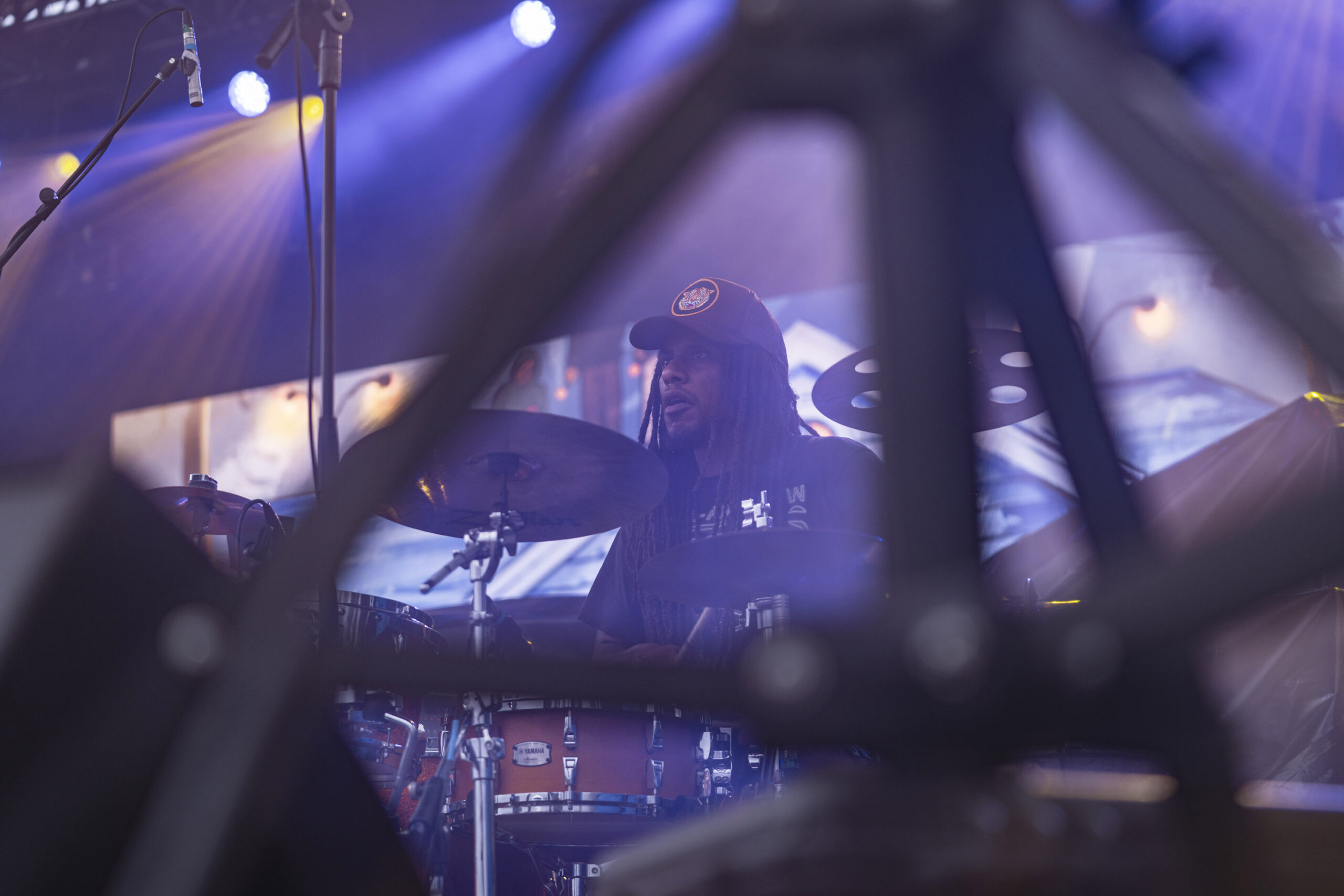 Kimo “Omik” Carpenter performs on drums during DENM’s set at Beak & Skiff Apple Orchards on Sunday. Carpenter backed Mac Montgomery as DENM brought its Southern California sound to the orchard. Photo by Matt Hofmann.