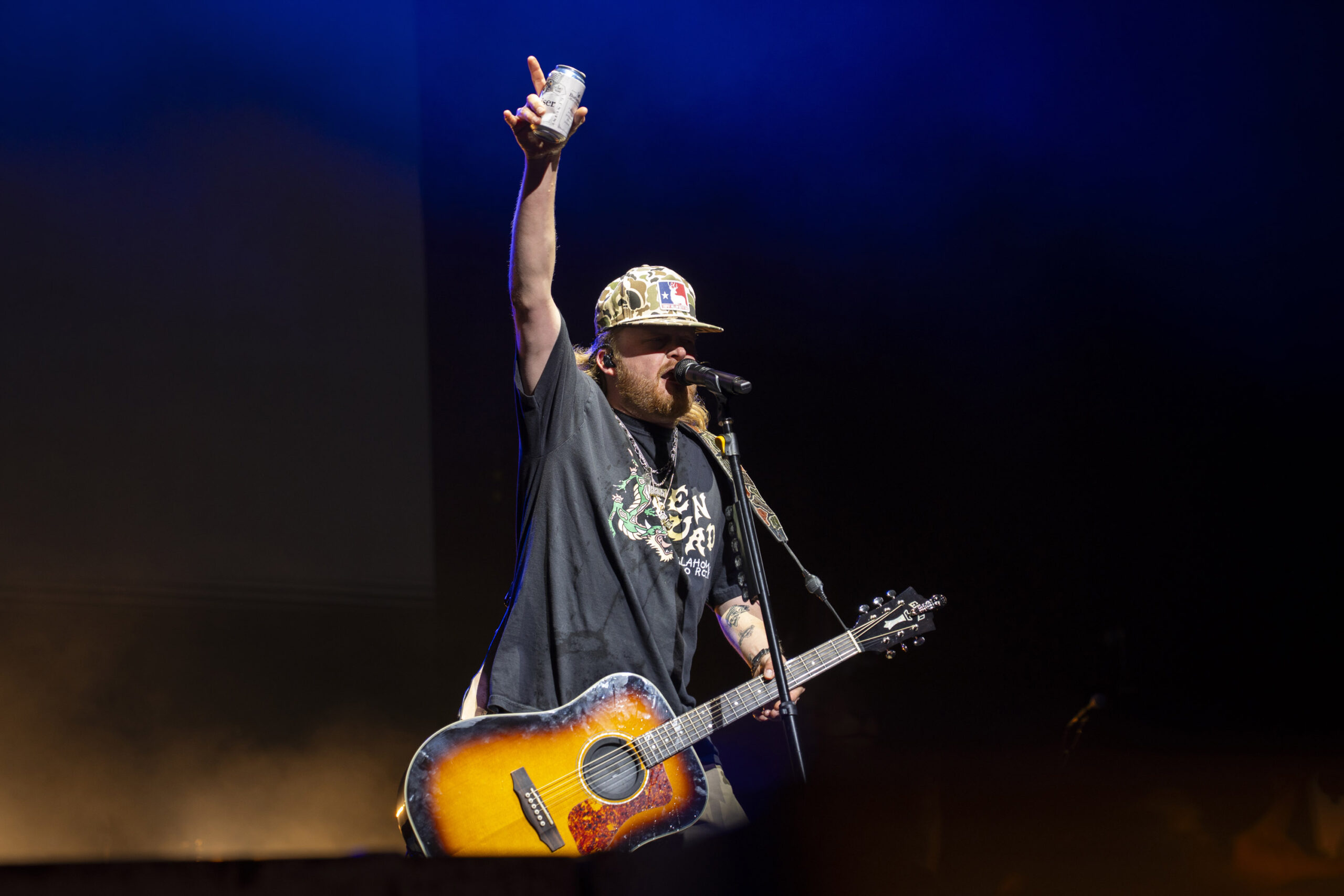 Treaty Oak Revival frontman Sam Canty raises a drink above the crowd during the band’s headlining set in Syracuse, N.Y., on Thursday, Sept. 24, 2026. Canty frequently cracked open and sprayed cans of nonalcoholic beer throughout the performance. Photo by Matt Hofmann.