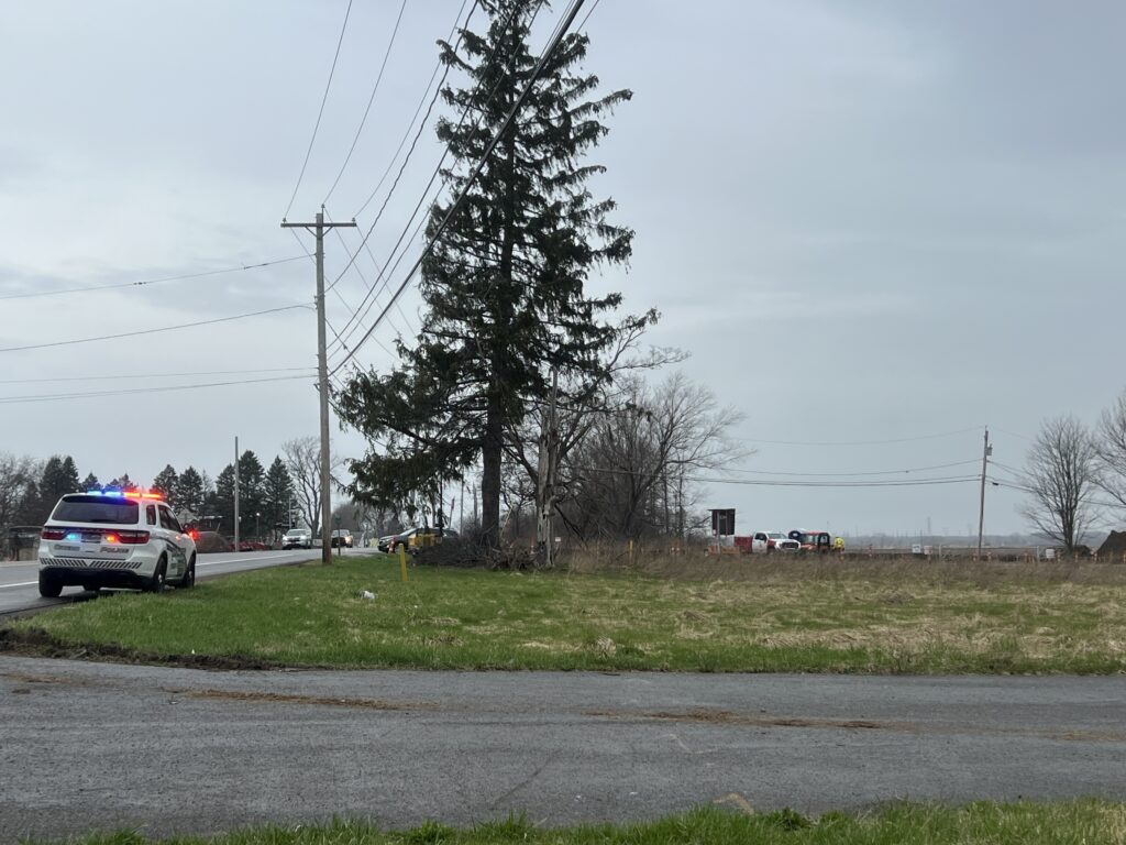 The construction site of Micron Technology monitored with a police car that has its lights on.