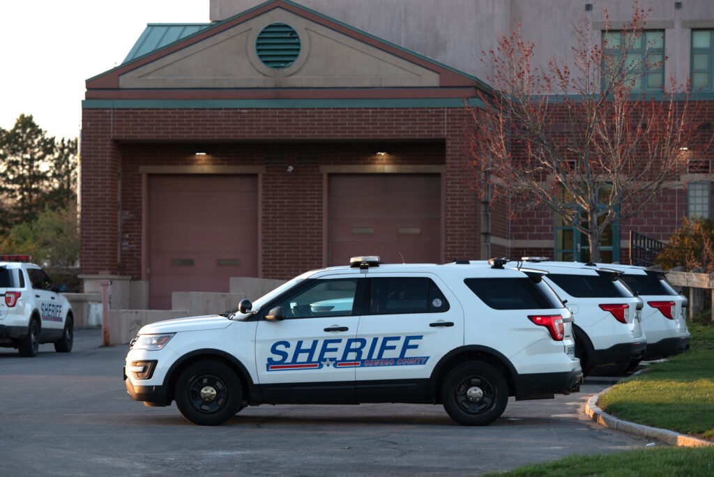 Vehicles parked at the Oswego County Sheriff's Office at 39 Churchill Road in Oswego.