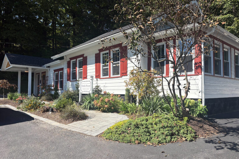 The Clerk’s House’s traditional home exterior reflects its 100-year history.