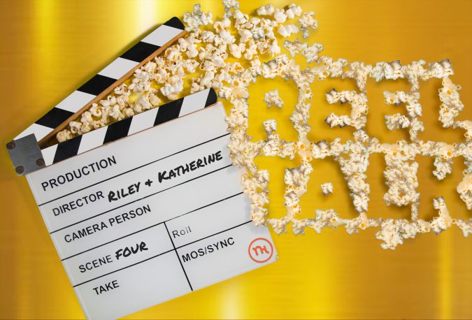 Popcorn spells out "Reel Talk" next to a film clapper.