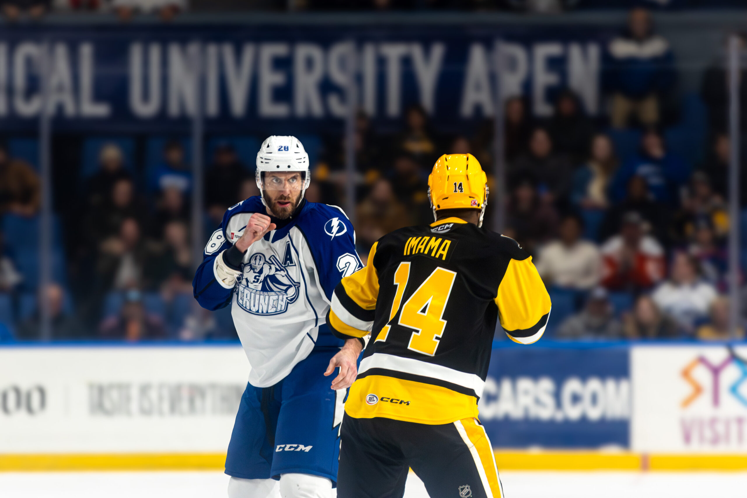 Syracuse Crunch defenseman Jarred Tinordi and Wilkes Barre/Scranton Penguins forward Bokondji Imama fight during their game on Saturday, January 3rd, 2025, at the Upstate Medical University Arena.