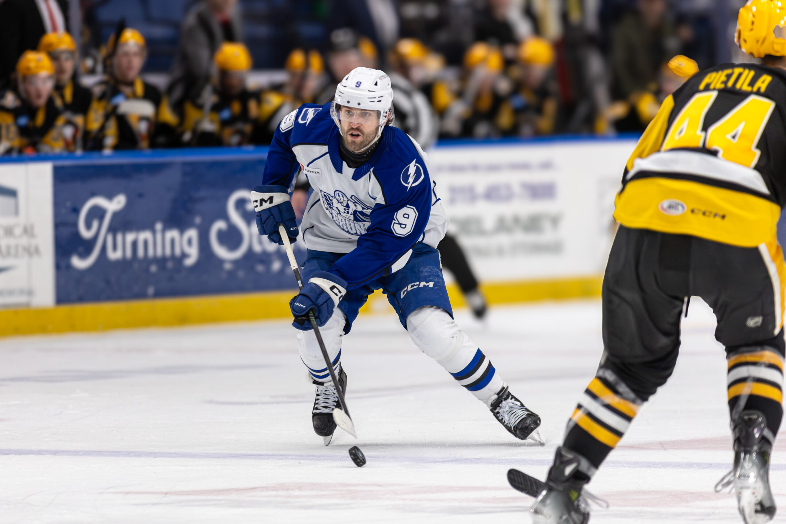 Syracuse Crunch forward Wojciech Stachowiak handles the puck during a 6-0 win against the Wilkes Barre/Scranton Penguins on Saturday, January 3rd, 2025, at the Upstate Medical University Arena.